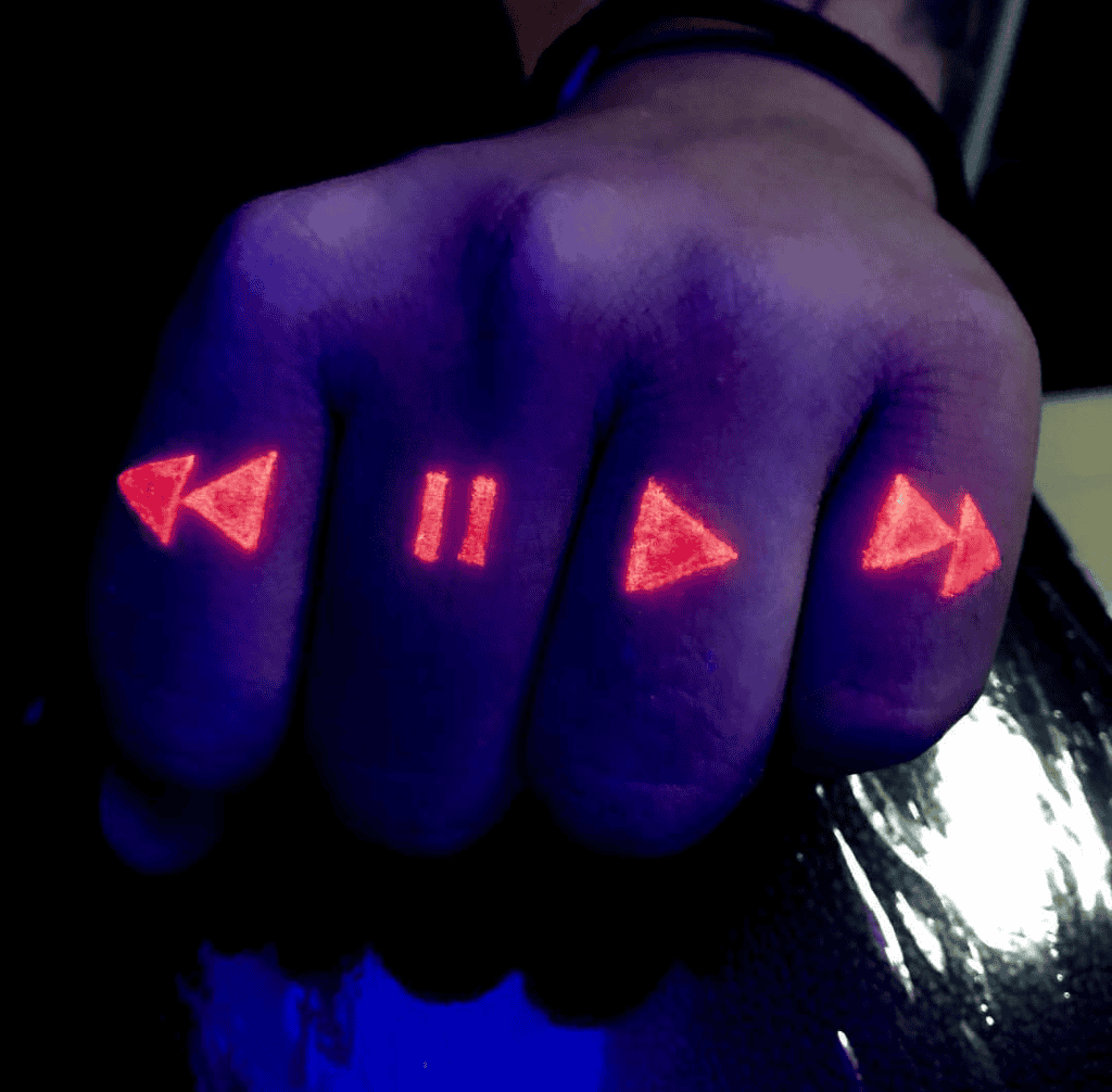 Black Light Tattoo On Fingers