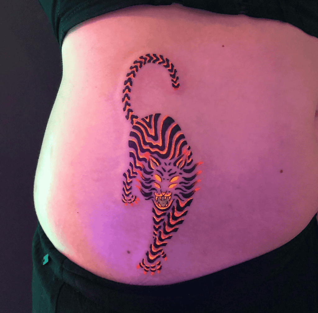 Black Light Tiger Tattoo On Abdomen