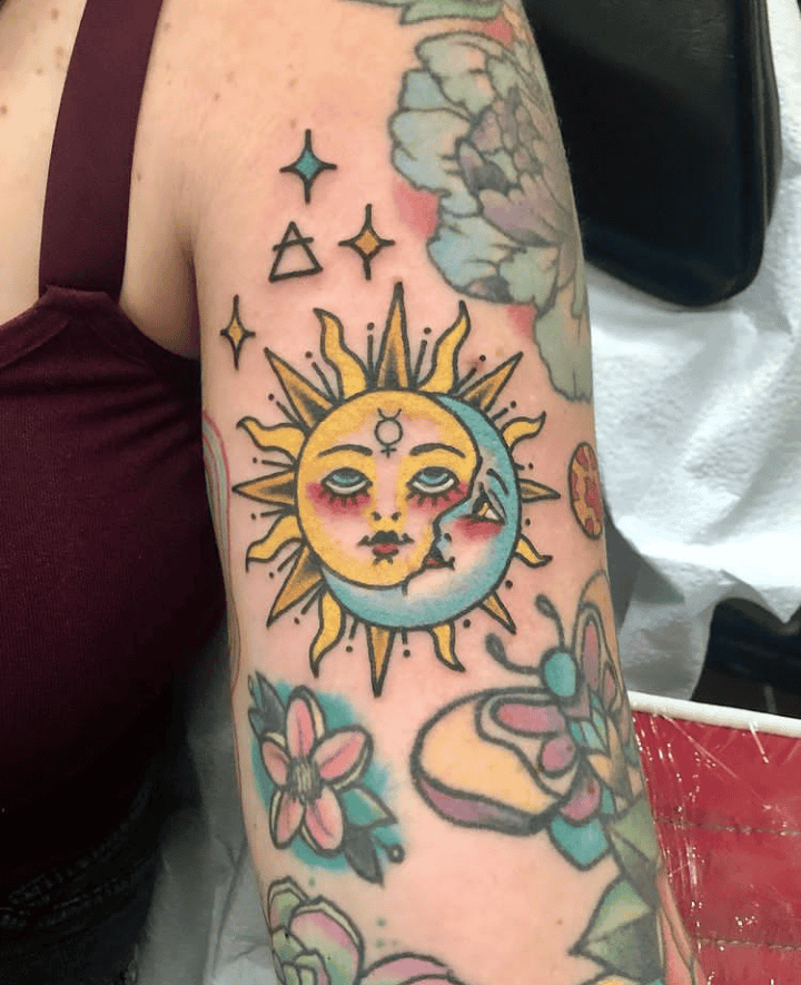 Colorful Sun And Moon Bicep Tattoo