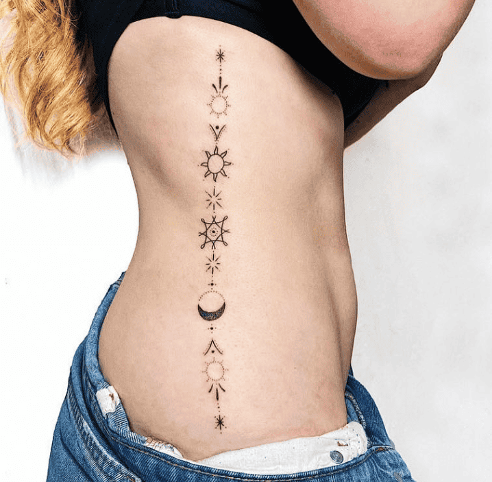 ‘Handpoked’ Sun And Moon Solar System Design On Rib