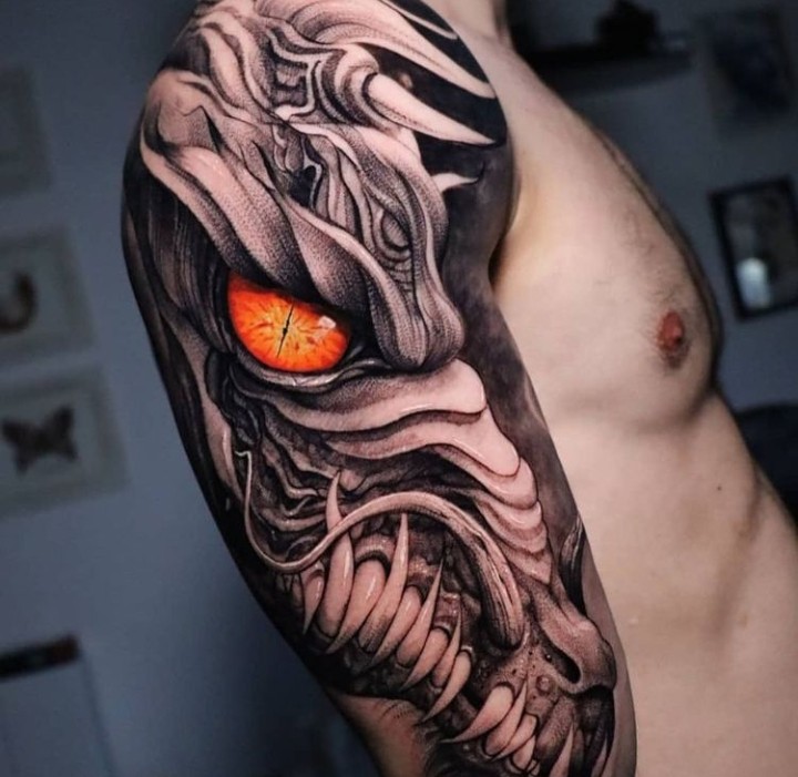Photo-Realistic Dragon Skeleton Tattoo on Arm