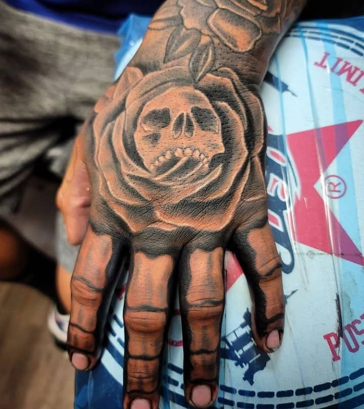 Skeleton Face, Rose, And Skeleton Hand Tattoo