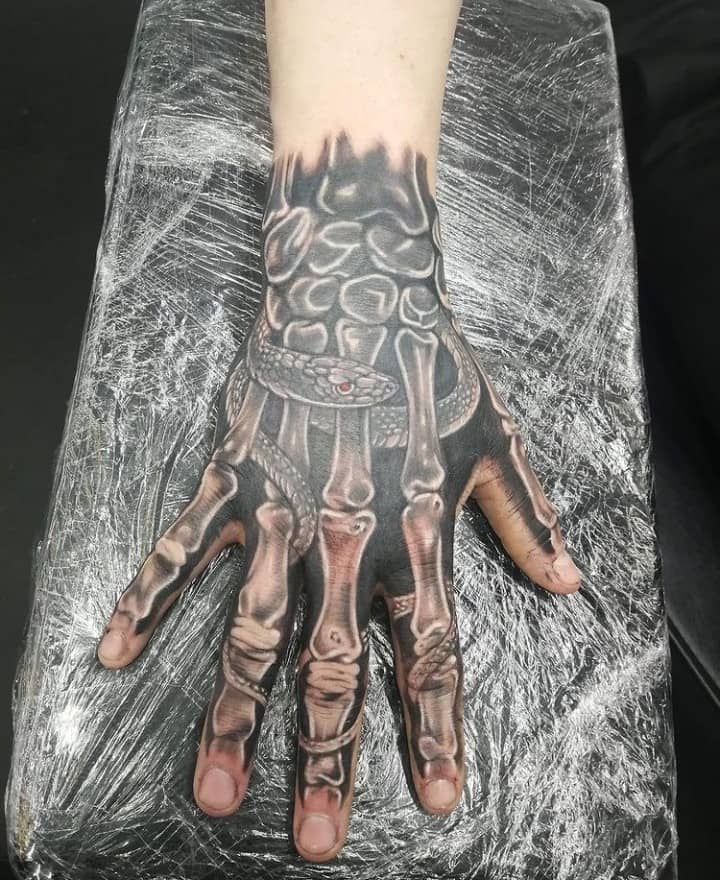 Skeleton Hand Tattoo With Snake