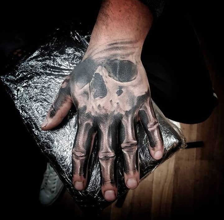 Skull Face Skeleton Hand Tattoo