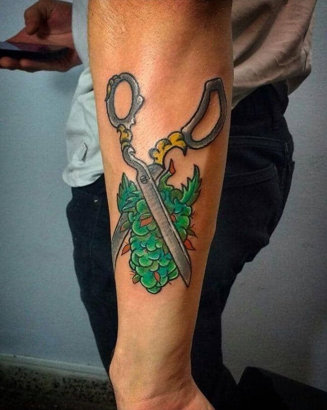 Scissors With a Marijuana Tattoo