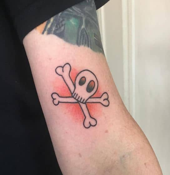 Cute Skull and Crossbones Tattoo on the Inner Bicep